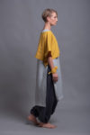 Cropped length and half sleeves of the linen lagenlook top DION shown in a side angle.