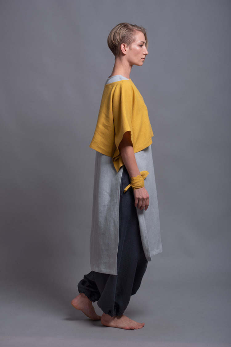 Cropped length and half sleeves of the linen lagenlook top DION shown in a side angle.