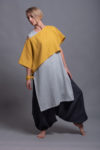 Model showcasing the top DION styled with wide-leg linen pants for a casual layered look.