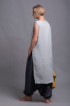 Back view of the KENI tunic, displaying the flowing flax linen fabric and longer hemline.