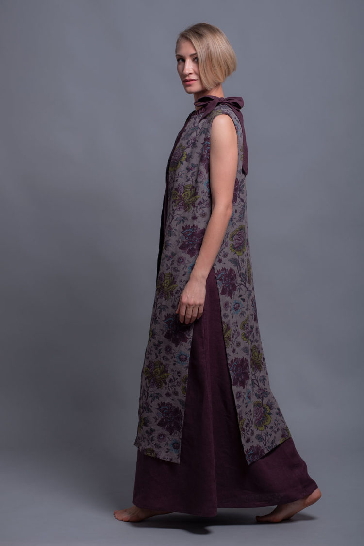 Side view of a long linen vest featuring high side slits for elegant movement.