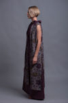 Long open-front linen vest styled with linen dress for a sophisticated look.