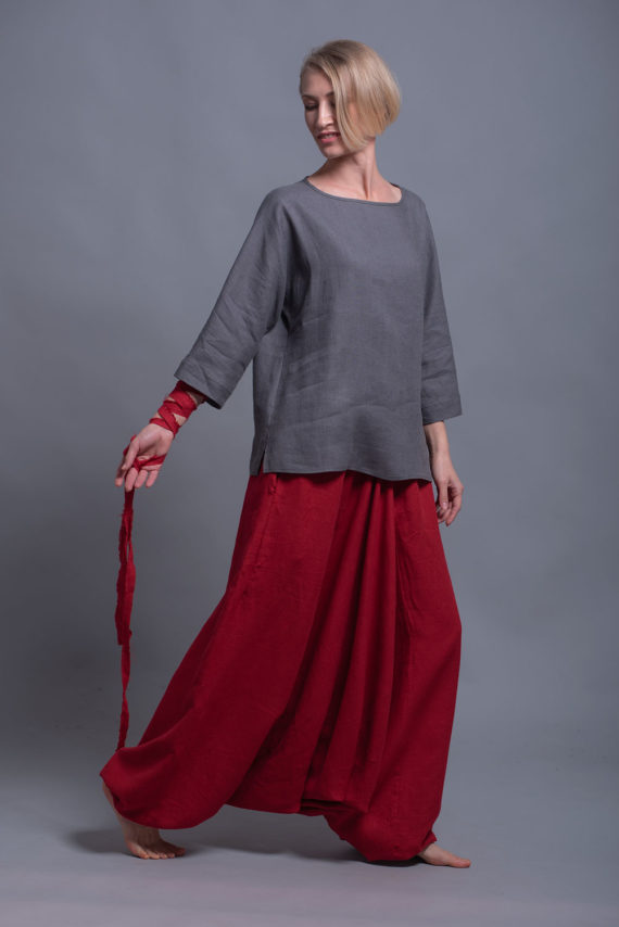 Model showcasing the hip-length hem and flowing silhouette of the SOVA blouse