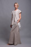 Side angle of the linen maxi skirt, featuring functional hidden pockets.