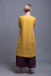Back view showcasing the flowing, breathable medium-weight linen fabric of the tunic dress.