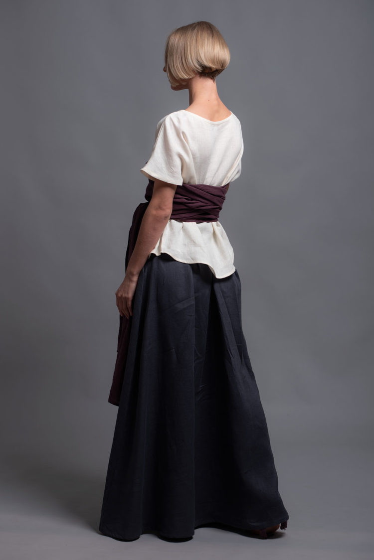 Side view of the linen top TOD, highlighting rounded hem design.