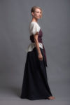 Model showcasing the versatility of the linen top TOD styled with accessories.