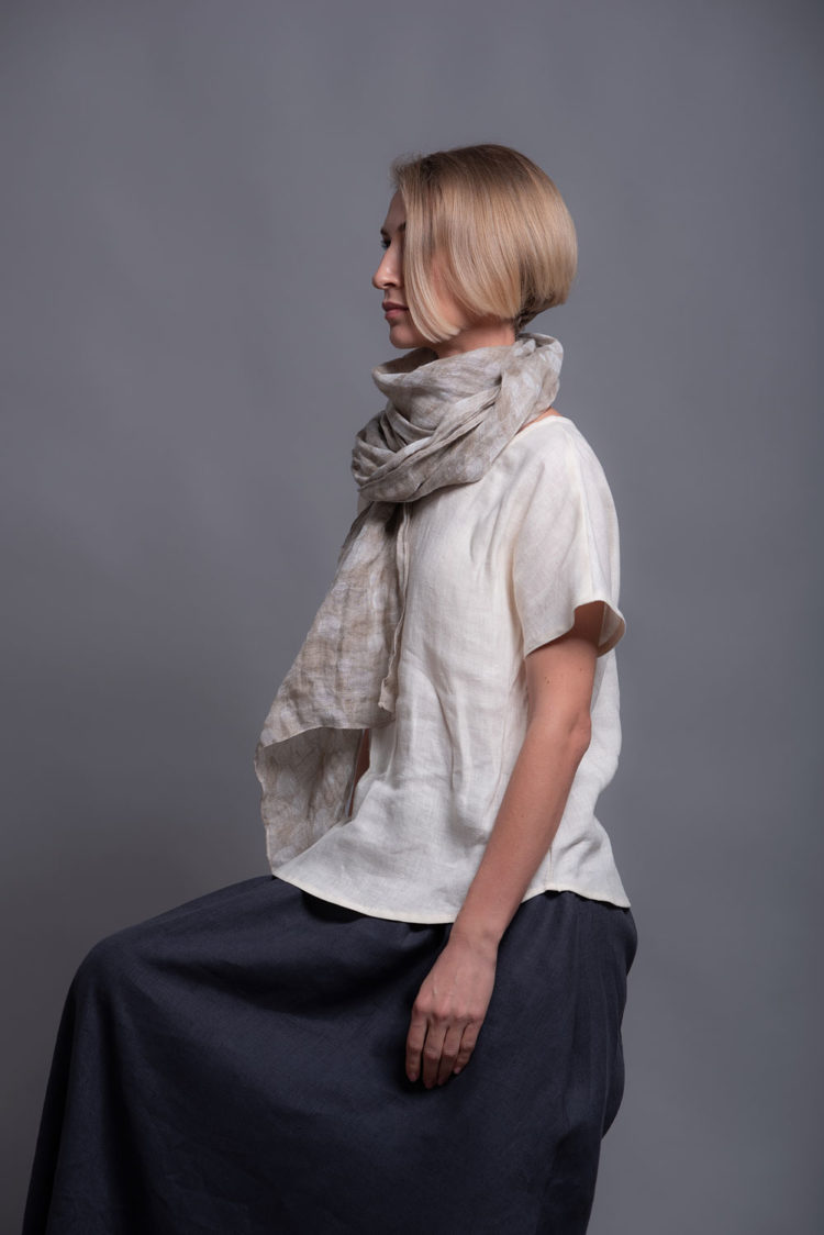 Close-up of the open crewneck and short sleeves for a minimalist look.