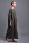 Model wearing a breathable long linen caftan dress, ideal for everyday wear and special occasions