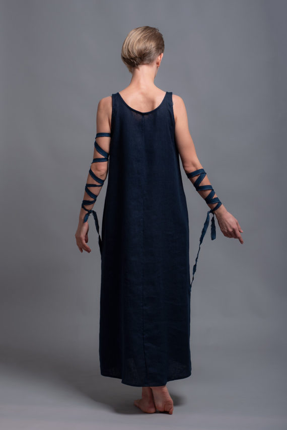Back view of a sleeveless linen maxi dress in dark blue, showcasing a scoop neckline and elegant drape.