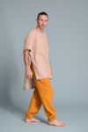 6️⃣ Model wearing a men’s breathable summer tunic with linen pants