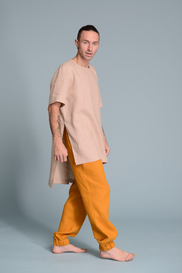 6️⃣ Model wearing a men’s breathable summer tunic with linen pants