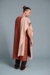 A person wearing a natural flax linen scarf, perfect for all-season styling