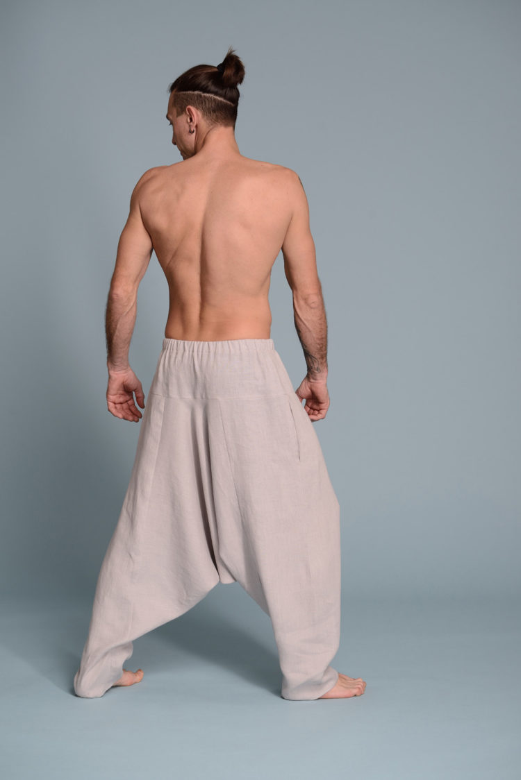 Back view of linen harem pants, showcasing wide-leg silhouette and draped design