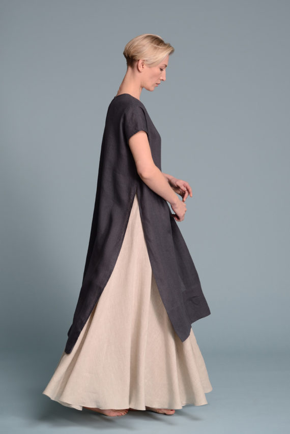 Side profile of the unisex linen tunic, showing its relaxed fit and asymmetrical hem