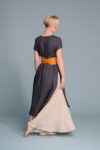 Back view of the tied linen obi belt MARU in turmeric on a model