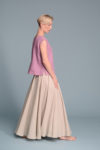 Side view of the Linen Blouse SOD showcasing its A-line silhouette and small side slits.