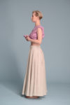 Side profile of the PERAH linen skirt, highlighting its graceful movement and elastic waistband