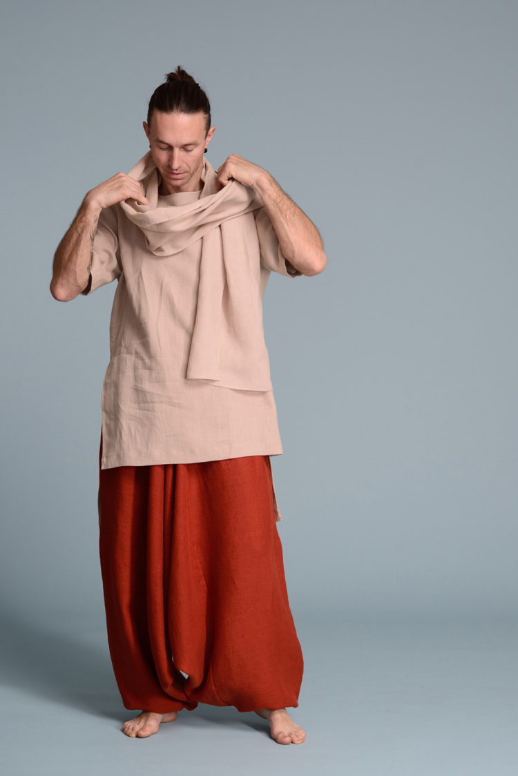 Light and airy men’s linen scarf wrapped around the neck, perfect for summer layering.