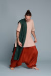 Model wearing a medium-weight linen scarf with a layered outfit