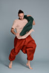 Men’s natural linen scarf in emerald green, draped over shoulders