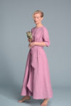 Side view of the TANIA maxi dress, emphasizing its clean lines and timeless design.