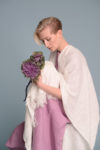Close-up of the coarse open-weave linen texture on the Milk White cape