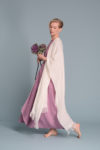 Model wearing the Open-Weave Linen Cape in Natural Flax, highlighting the breathable open-weave linen fabric