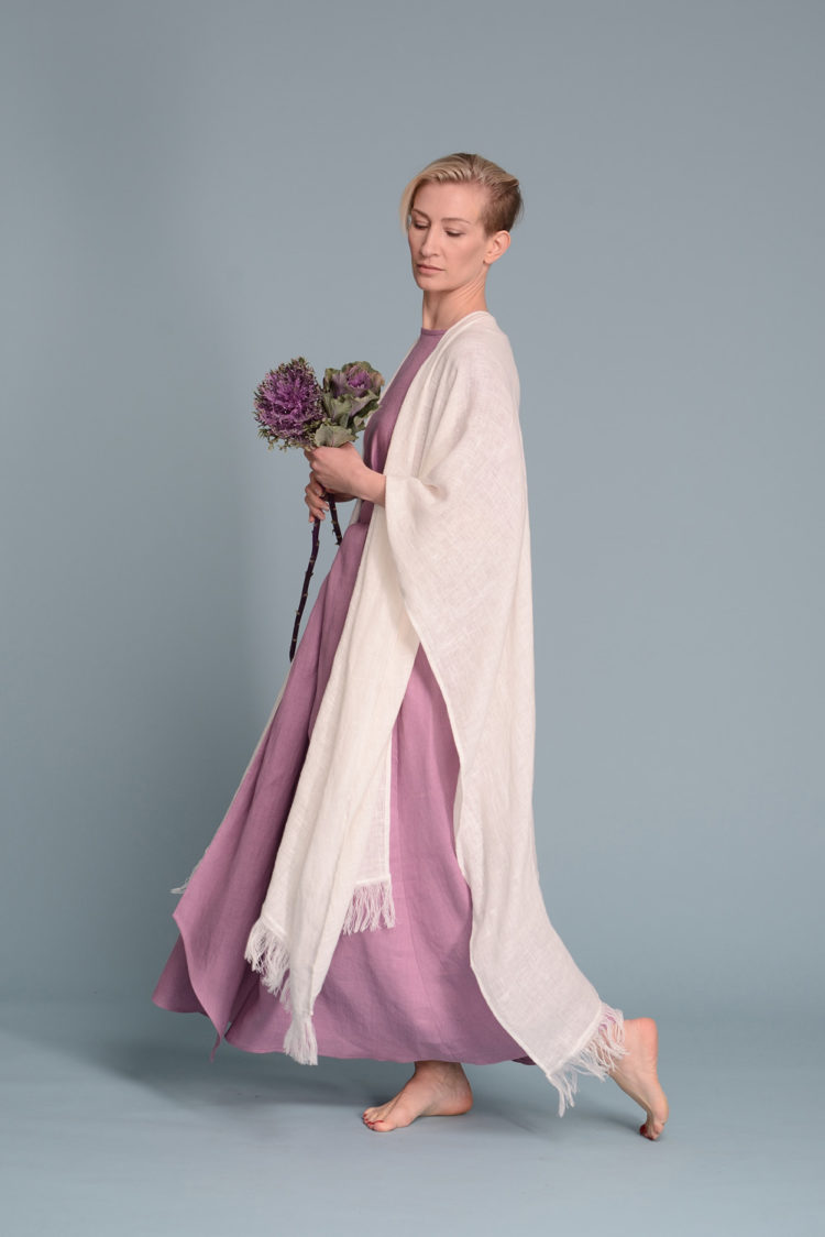 Model wearing the Open-Weave Linen Cape in Natural Flax, highlighting the breathable open-weave linen fabric