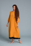 Yellow linen dress with round neckline and soft linen texture.