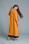 Side view of the Linen Dress NIKA, highlighting the three-quarter length sleeves and hidden side pockets.