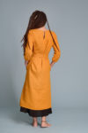 Back view of the linen dress, showing the straight hemline and mid-calf length.