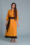 Model wearing the Linen Dress NIKA in Turmeric, perfect for versatile styling.