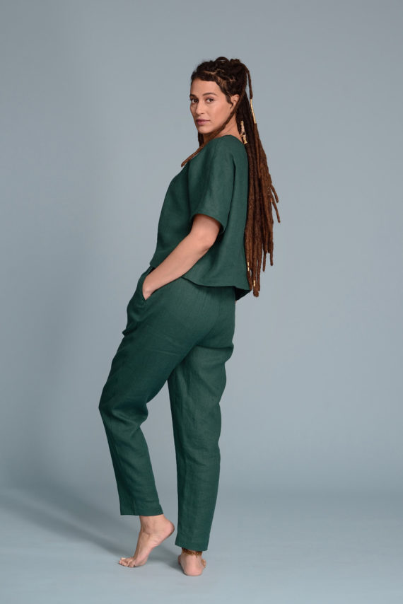 Back view of high-waisted linen cigarette pants, highlighting the tailored fit.