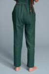 Close-up of breathable 100% natural linen fabric in green color.