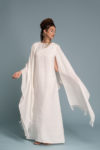 Casual styling of the Open-Weave Linen Cape in Milk White, suitable for everyday wear—comfortable and breathable