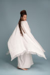 Model gracefully moving in the Open-Weave Linen Cape, demonstrating the flow of the fabric