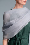 Woman wearing a gauze linen shawl as a beach cover-up