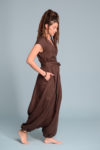 Side profile of the TALISE linen jumpsuit, showcasing its relaxed fit and hidden side pockets.
