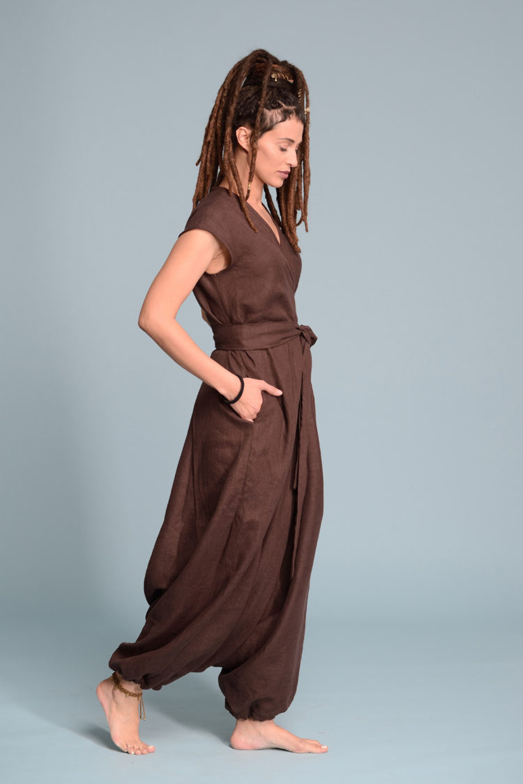 Side profile of the TALISE linen jumpsuit, showcasing its relaxed fit and hidden side pockets.