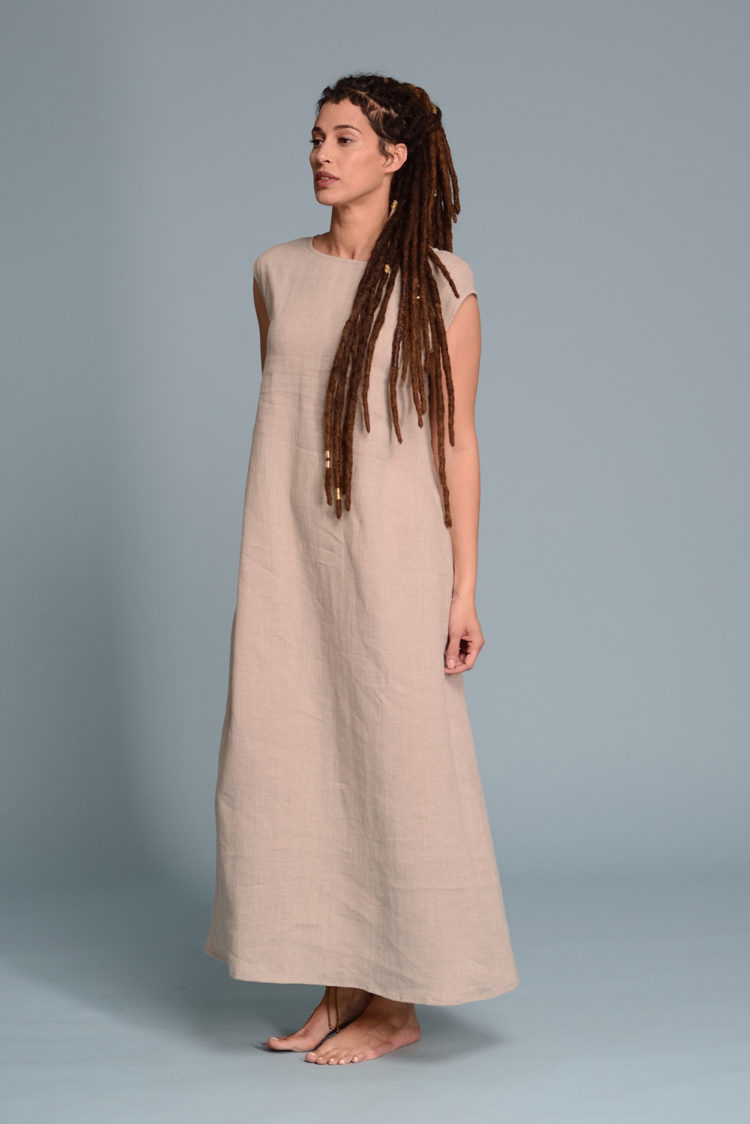 A lightweight linen dress in soft beige, perfect for warm-weather wear with its breezy fabric.