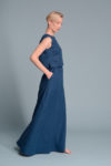 Side profile of the LUNA linen tank top highlighting its straight cut and small side slits