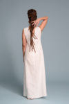 The maxi-length hemline, adding an elegant, elongated silhouette.