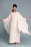 Model in motion, demonstrating the fluid and relaxed fit of the linen dress.