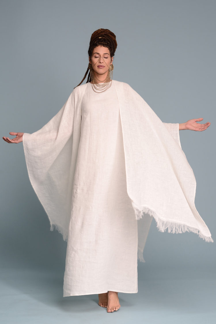 Model in motion, demonstrating the fluid and relaxed fit of the linen dress.