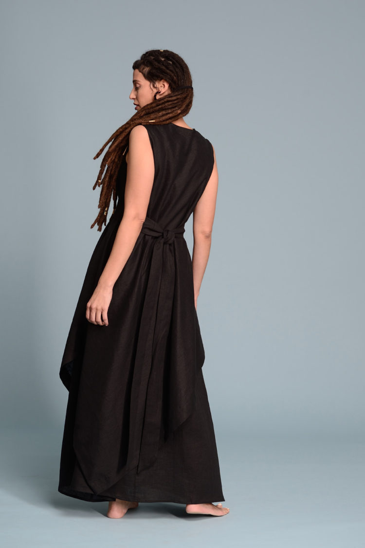 Back view of the Double Layered Linen Dress EFRAT, highlighting its elegant drape and sleeveless design