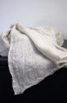 Natural linen SPF scarf, an airy and stylish way to stay protected from the sun.