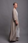 Side view of a long sleeve linen coat with narrow sleeves and an open front.