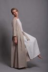 Model wearing an open front linen jacket over a sleeveless tunic.