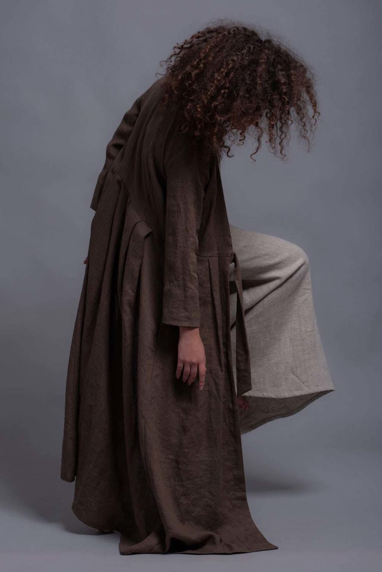 Elegant linen outerwear with narrow sleeves, best worn with sleeveless tops.